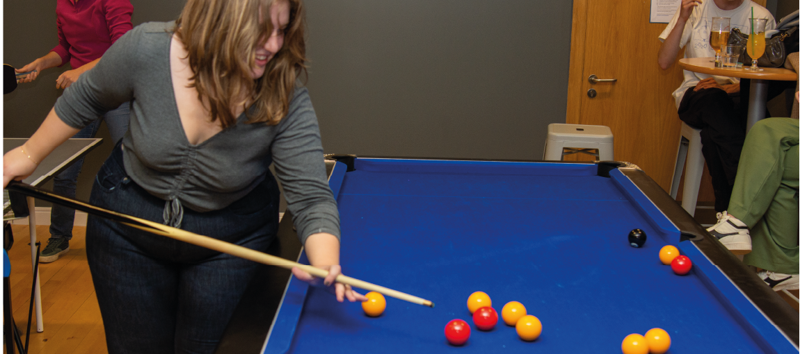 Photo of female student playing pool at Ayr union