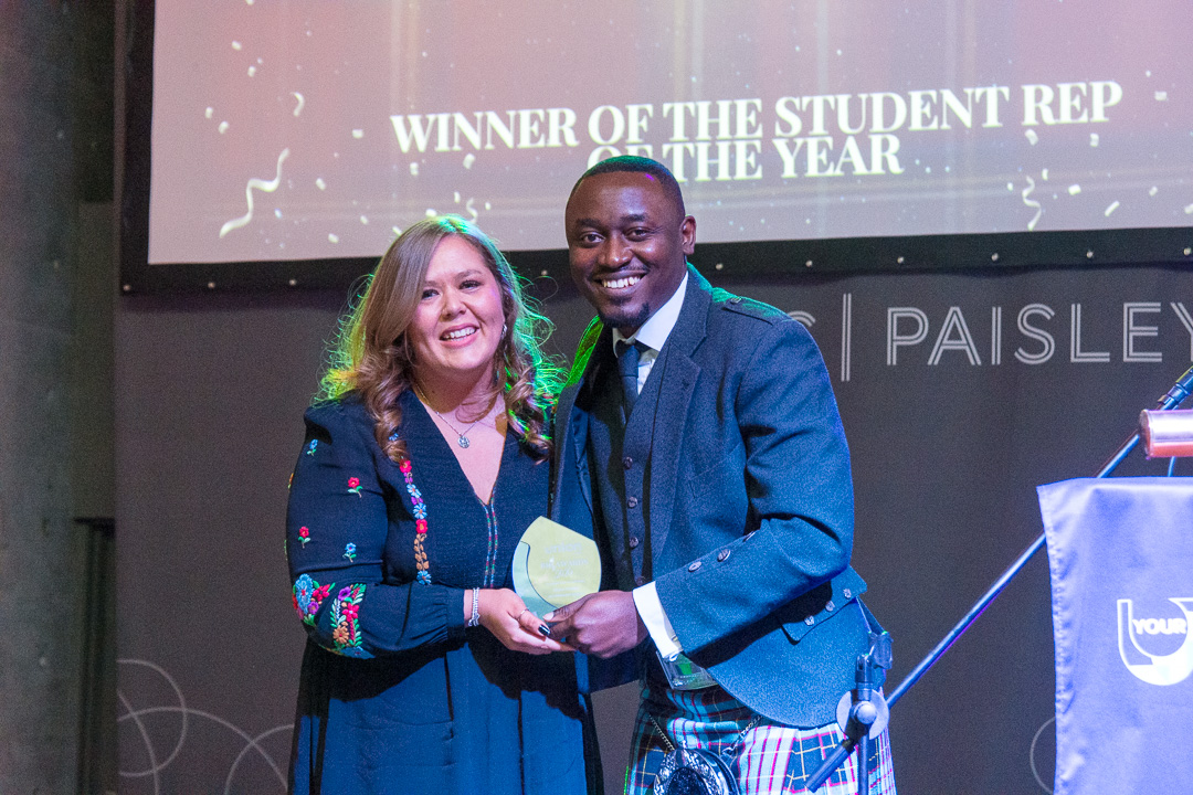 A student rep being presented with the rep of the year award