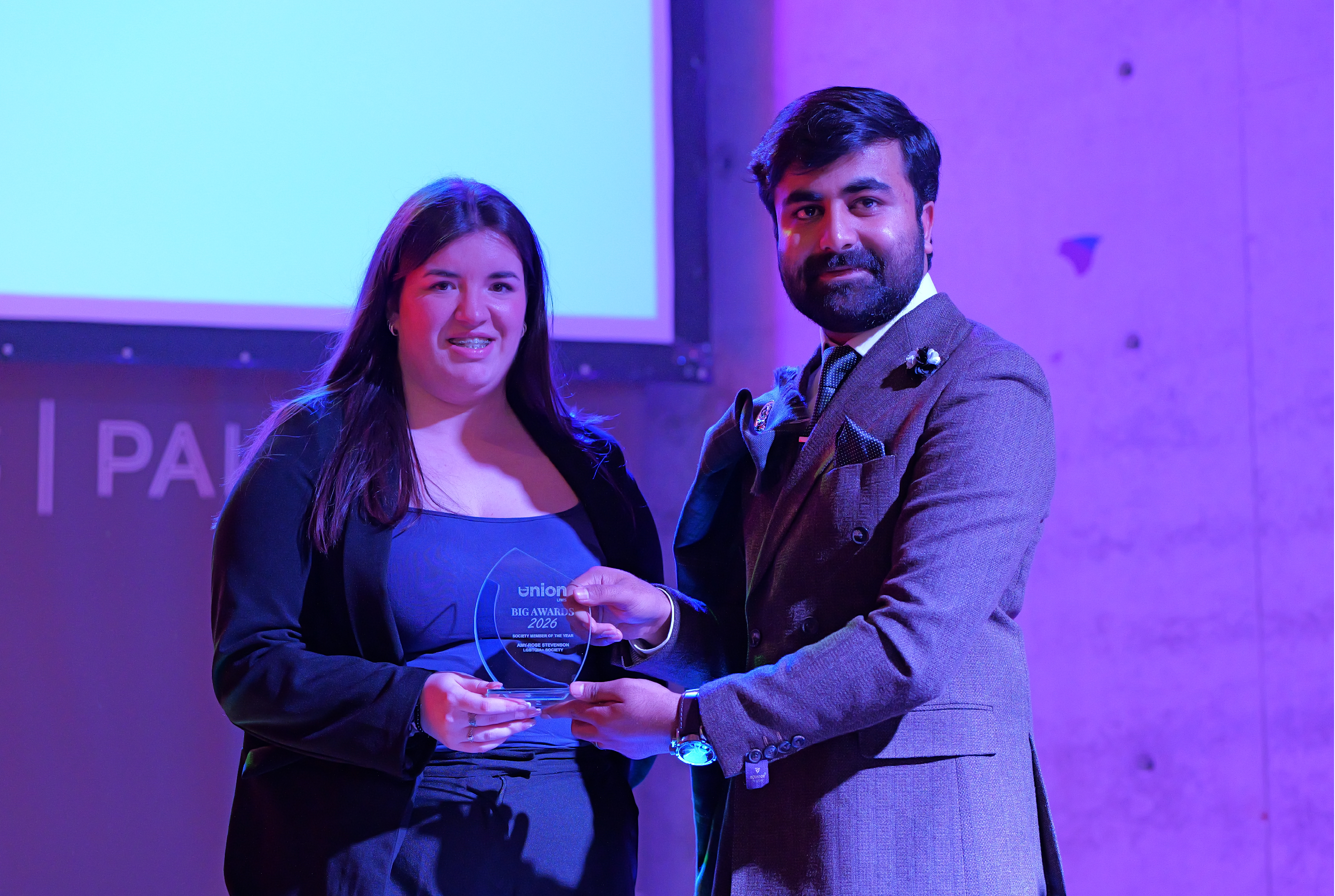 Amy-Rose receiving their award from VP Welfare  